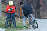 boys on bikes with mobile